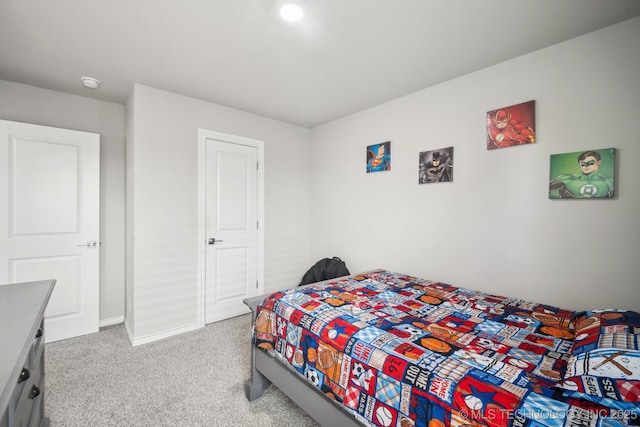 carpeted bedroom featuring baseboards