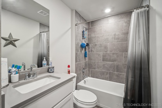 bathroom featuring shower / tub combo, vanity, and toilet