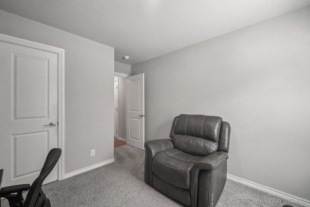 office featuring baseboards and carpet flooring