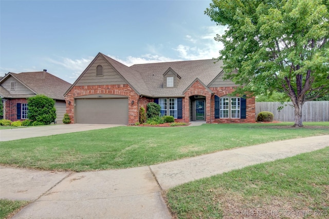 1901 N 8th St, Broken Arrow, OK 74012 - view of front of house featuring brick siding, a garage, driveway, and a shingled roof