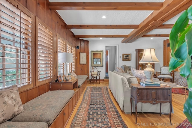 2815 S Woodward Blvd, Tulsa, OK 74114 - living room featuring wood finished floors, beamed ceiling, and wood walls