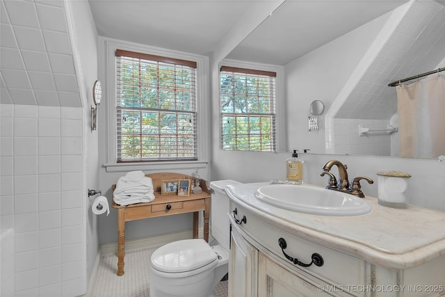 2815 S Woodward Blvd, Tulsa, OK 74114 - bathroom with healthy amount of natural light, toilet, vanity, and a shower with curtain