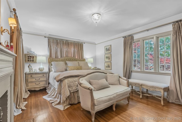 2815 S Woodward Blvd, Tulsa, OK 74114 - bedroom featuring wood finished floors and crown molding