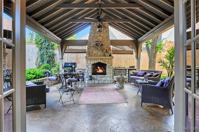 2815 S Woodward Blvd, Tulsa, OK 74114 - view of patio featuring a gazebo, a fenced backyard, and an outdoor living space with a fireplace