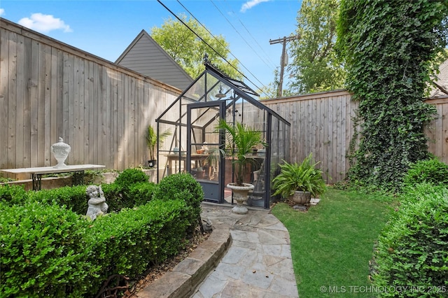 2815 S Woodward Blvd, Tulsa, OK 74114 - view of yard with a greenhouse and an outbuilding