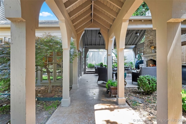 2815 S Woodward Blvd, Tulsa, OK 74114 - view of patio / terrace with an outdoor living space with a fireplace