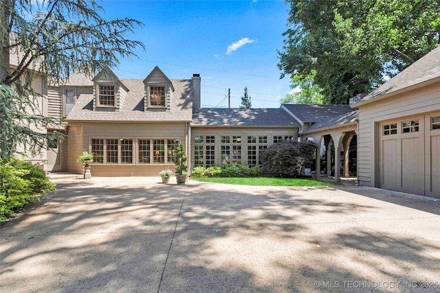 2815 S Woodward Blvd, Tulsa, OK 74114 - view of front facade featuring a chimney and a shingled roof