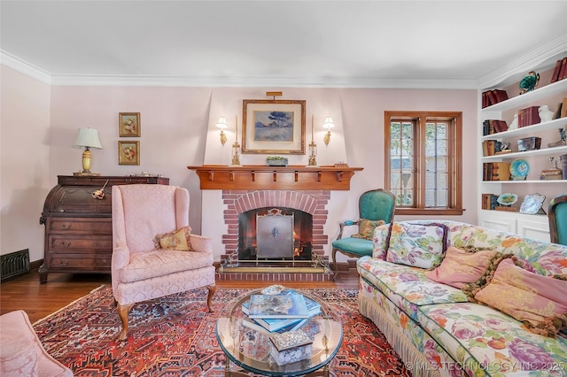 2815 S Woodward Blvd, Tulsa, OK 74114 - living area featuring wood finished floors, crown molding, and a brick fireplace