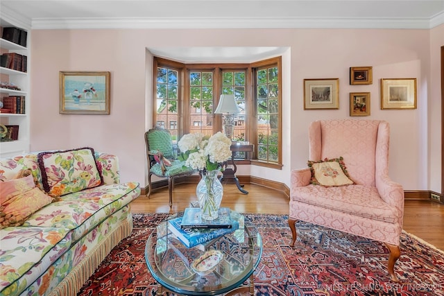 2815 S Woodward Blvd, Tulsa, OK 74114 - living area featuring wood finished floors, ornamental molding, and baseboards
