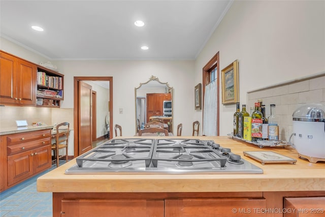 2815 S Woodward Blvd, Tulsa, OK 74114 - kitchen with stainless steel gas cooktop, open shelves, ornamental molding, decorative backsplash, and recessed lighting