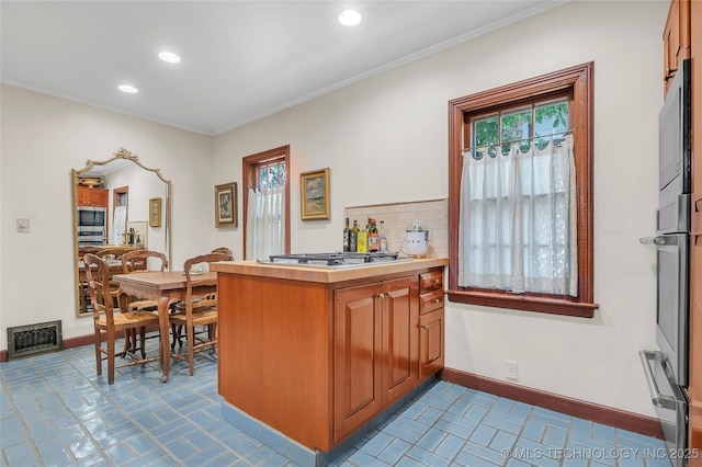 2815 S Woodward Blvd, Tulsa, OK 74114 - bar area featuring appliances with stainless steel finishes, recessed lighting, crown molding, a warming drawer, and baseboards