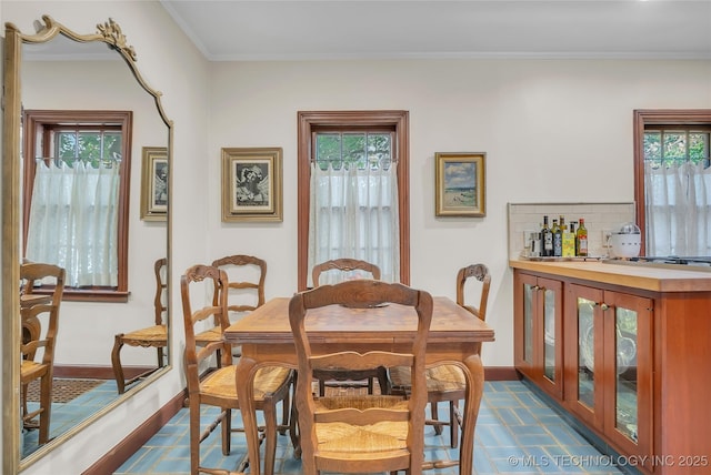 2815 S Woodward Blvd, Tulsa, OK 74114 - dining space with ornamental molding and baseboards