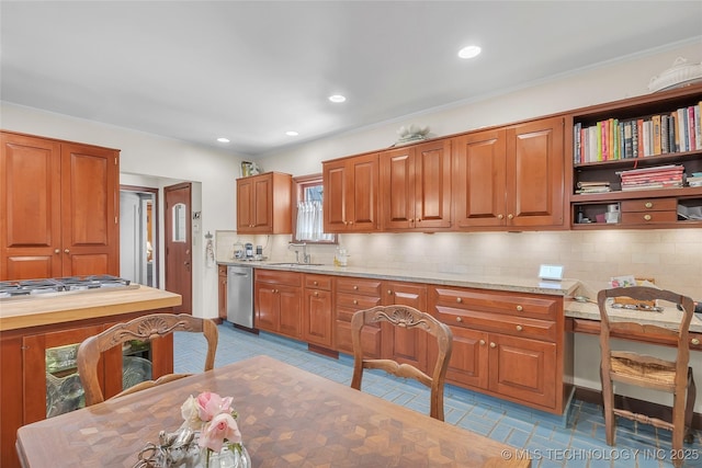 2815 S Woodward Blvd, Tulsa, OK 74114 - kitchen featuring backsplash, a sink, brown cabinetry, and recessed lighting