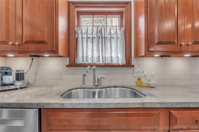 2815 S Woodward Blvd, Tulsa, OK 74114 - kitchen featuring a sink, brown cabinets, decorative backsplash, and light stone counters