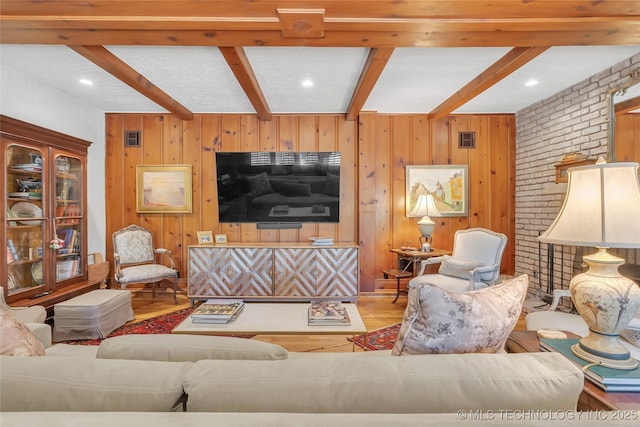 2815 S Woodward Blvd, Tulsa, OK 74114 - living room with beamed ceiling, wood finished floors, wood walls, and recessed lighting