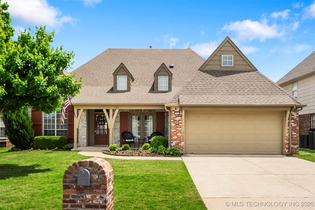 new england style home featuring french doors, a front yard, a shingled roof, brick siding, and an attached garage