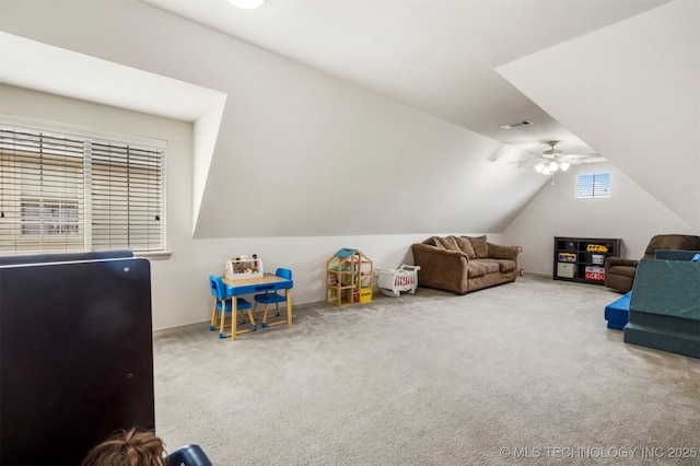 carpeted bedroom with lofted ceiling