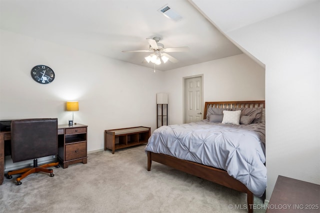 bedroom with light carpet and a ceiling fan