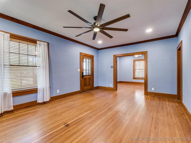 1618 S Rockford Ave, Tulsa, OK 74120 - unfurnished room featuring crown molding, plenty of natural light, a ceiling fan, light wood-type flooring, and baseboards