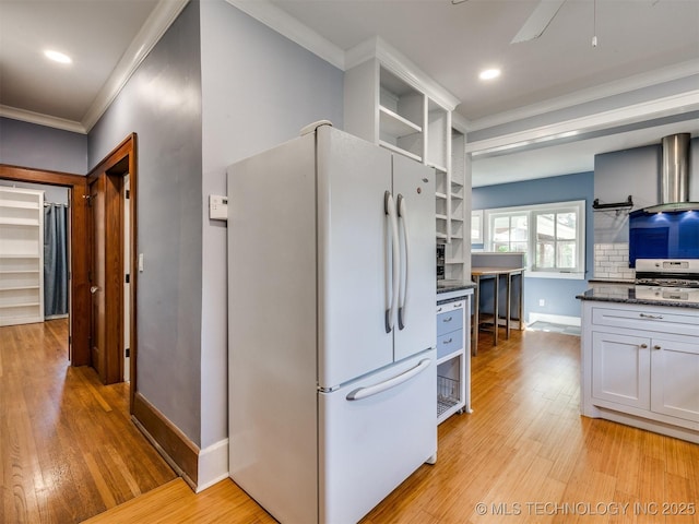 1618 S Rockford Ave, Tulsa, OK 74120 - kitchen with freestanding refrigerator, open shelves, ornamental molding, light wood-style flooring, and baseboards