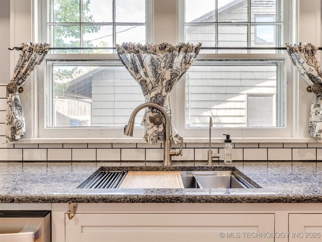 1618 S Rockford Ave, Tulsa, OK 74120 - kitchen view of a sink and dark stone counters