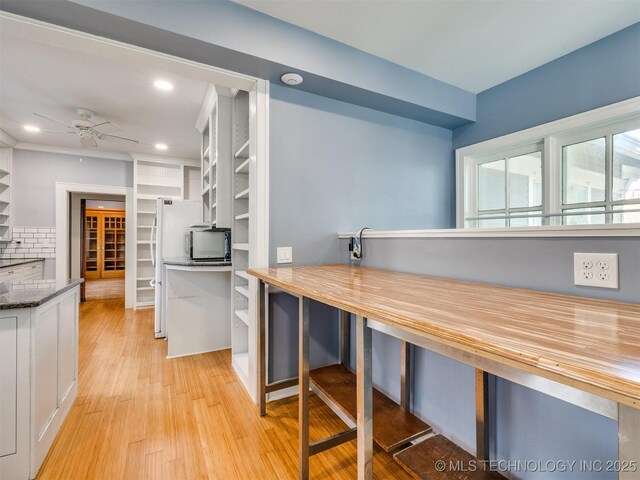 1618 S Rockford Ave, Tulsa, OK 74120 - kitchen with light wood finished floors, a ceiling fan, white cabinets, recessed lighting, and open shelves