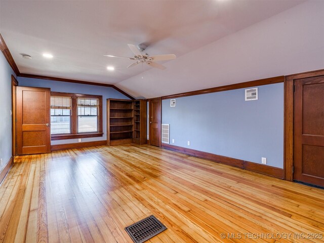 1618 S Rockford Ave, Tulsa, OK 74120 - unfurnished living room with baseboards, vaulted ceiling, light wood-type flooring, a ceiling fan, and crown molding