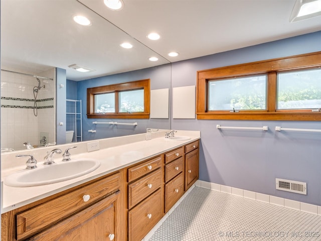 1618 S Rockford Ave, Tulsa, OK 74120 - full bath with toilet, tiled shower, recessed lighting, double vanity, and tile patterned flooring