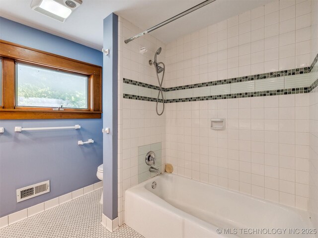 1618 S Rockford Ave, Tulsa, OK 74120 - full bathroom with baseboards, tile patterned floors, toilet, and shower / bath combination