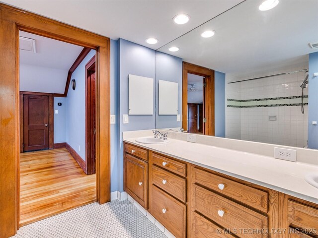 1618 S Rockford Ave, Tulsa, OK 74120 - bathroom featuring vanity, recessed lighting, a tile shower, and baseboards