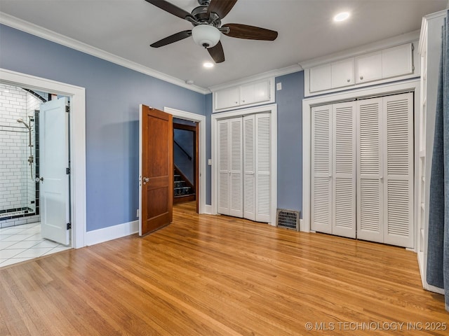 1618 S Rockford Ave, Tulsa, OK 74120 - unfurnished bedroom featuring ornamental molding, multiple closets, baseboards, light wood-style floors, and recessed lighting