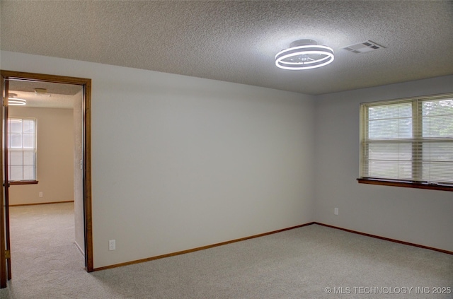 8242 S Sandusky Ave, Tulsa, OK 74137 - carpeted spare room with a textured ceiling and baseboards
