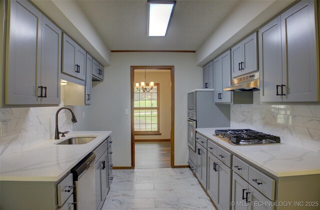 8242 S Sandusky Ave, Tulsa, OK 74137 - kitchen with a sink, under cabinet range hood, appliances with stainless steel finishes, a chandelier, and light marble finish floors