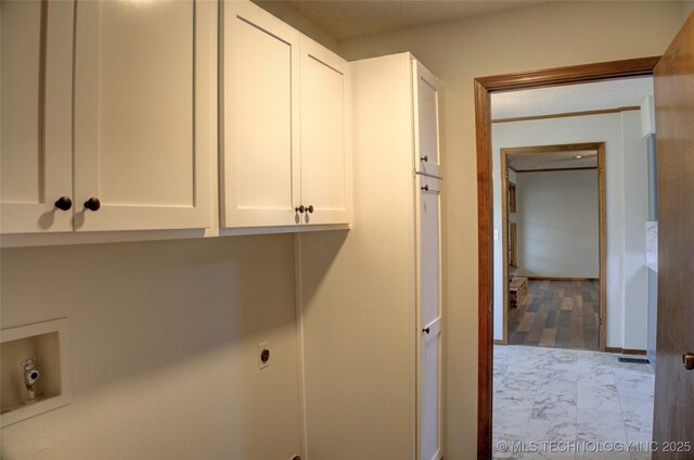 8242 S Sandusky Ave, Tulsa, OK 74137 - clothes washing area featuring cabinet space, electric dryer hookup, marble look tile flooring, and hookup for a washing machine
