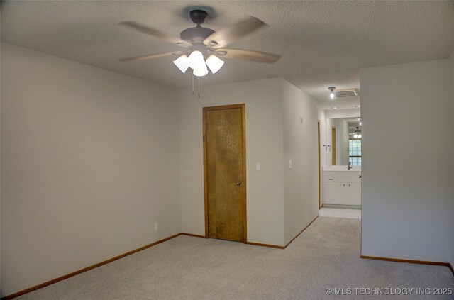 8242 S Sandusky Ave, Tulsa, OK 74137 - unfurnished room featuring light carpet, a ceiling fan, a textured ceiling, and baseboards