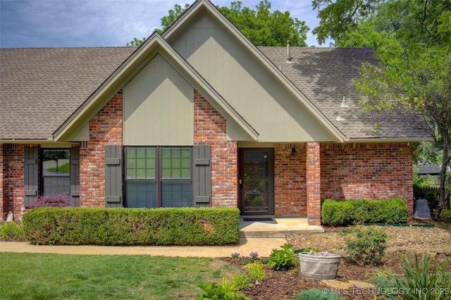 8242 S Sandusky Ave, Tulsa, OK 74137 - view of front of home with brick siding and roof with shingles