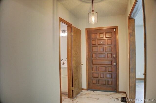 8242 S Sandusky Ave, Tulsa, OK 74137 - doorway with baseboards and light marble finish flooring