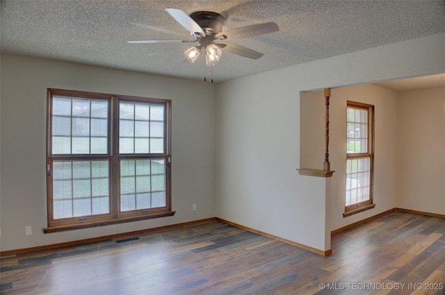 8242 S Sandusky Ave, Tulsa, OK 74137 - spare room with wood finished floors, a ceiling fan, a textured ceiling, and baseboards