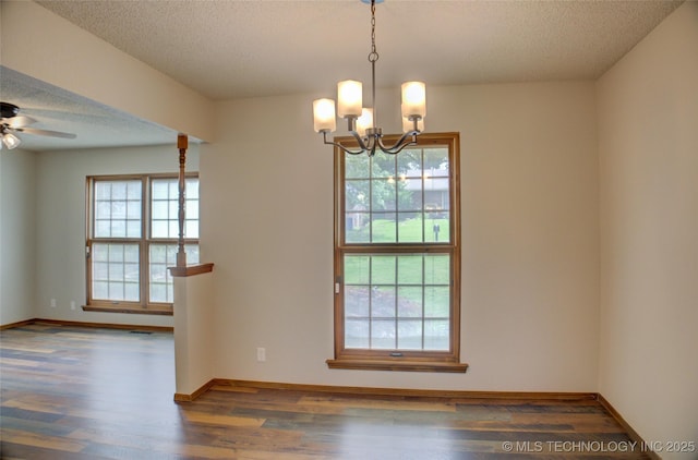 8242 S Sandusky Ave, Tulsa, OK 74137 - empty room featuring wood finished floors, a textured ceiling, a chandelier, a ceiling fan, and baseboards