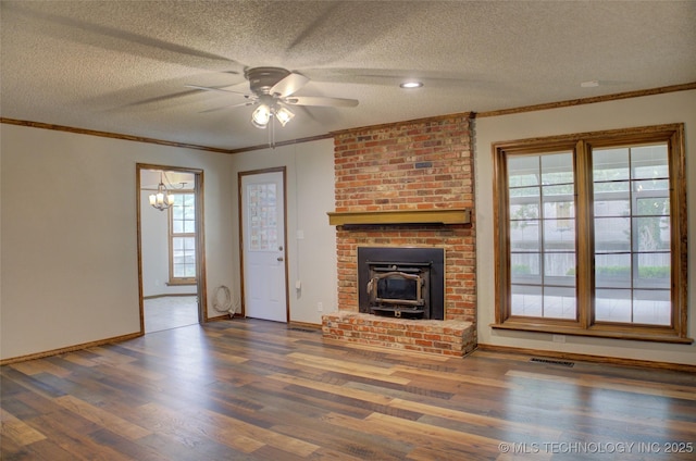 8242 S Sandusky Ave, Tulsa, OK 74137 - unfurnished living room featuring ceiling fan, wood finished floors, a textured ceiling, baseboards, and crown molding