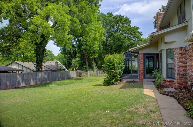 8242 S Sandusky Ave, Tulsa, OK 74137 - view of yard with a sunroom