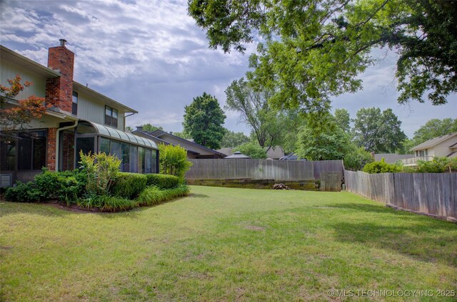 8242 S Sandusky Ave, Tulsa, OK 74137 - view of yard with a sunroom