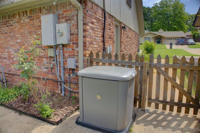8242 S Sandusky Ave, Tulsa, OK 74137 - exterior view of brick siding, fence, a power unit, and electric meter