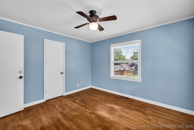 1223 E 31st St, Tulsa, OK 74105 - empty room featuring wood finished floors, ornamental molding, a ceiling fan, and baseboards
