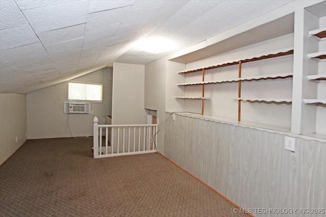 additional living space featuring carpet flooring and lofted ceiling
