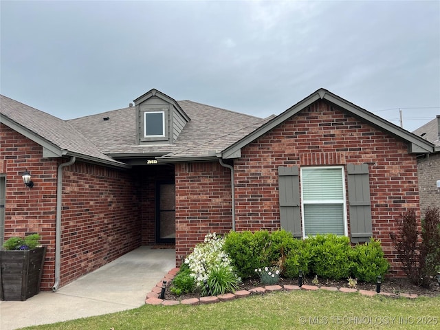 26815 E 142nd St S, Coweta, OK 74429 - property entrance with brick siding and a shingled roof