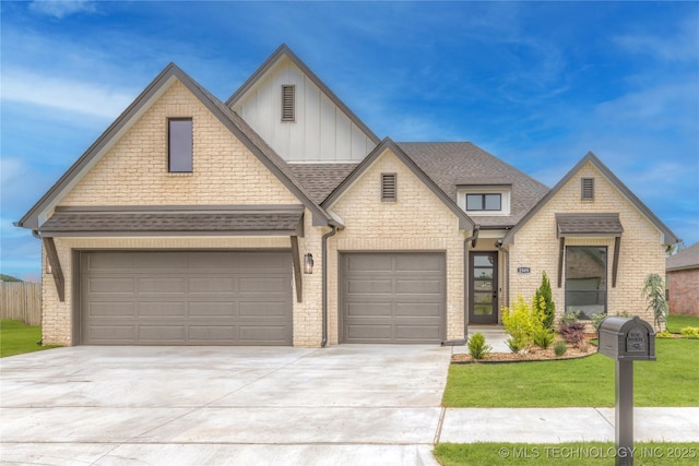 2989 E 145th St S, Bixby, OK 74008 - view of front of home with board and batten siding, driveway, brick siding, a shingled roof, and a front yard
