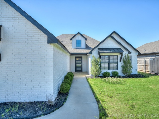 view of front of home with brick siding
