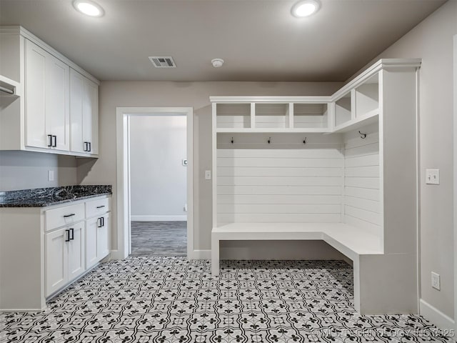 mudroom featuring recessed lighting and baseboards