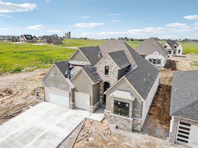 2607 E 135th Dr S, Bixby, OK 74008 - view of front of property with stone siding, stucco siding, and driveway